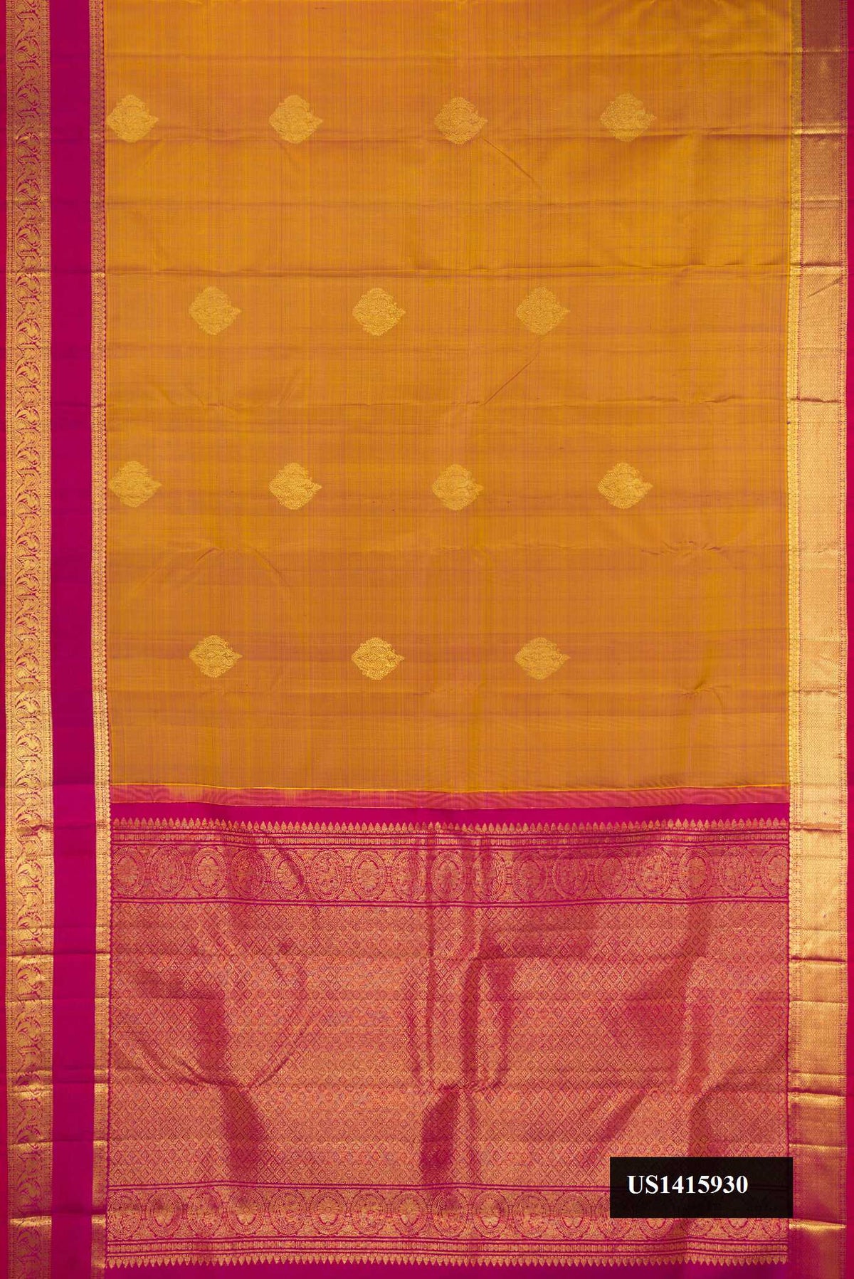 Mustard Dual Tone Kanchipuram Silk Saree with Zari Butta on the body and Zari Border.  displayed on a mannequin