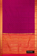 Magenta Dual Tone Kanchipuram Silk Saree with Zari Butta on the body and Zari Border.  displayed on a mannequin