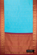 Light Blue Dual Tone Kanchipuram Silk Saree with Zari Butta on the body and Zari Border.  displayed on a mannequin