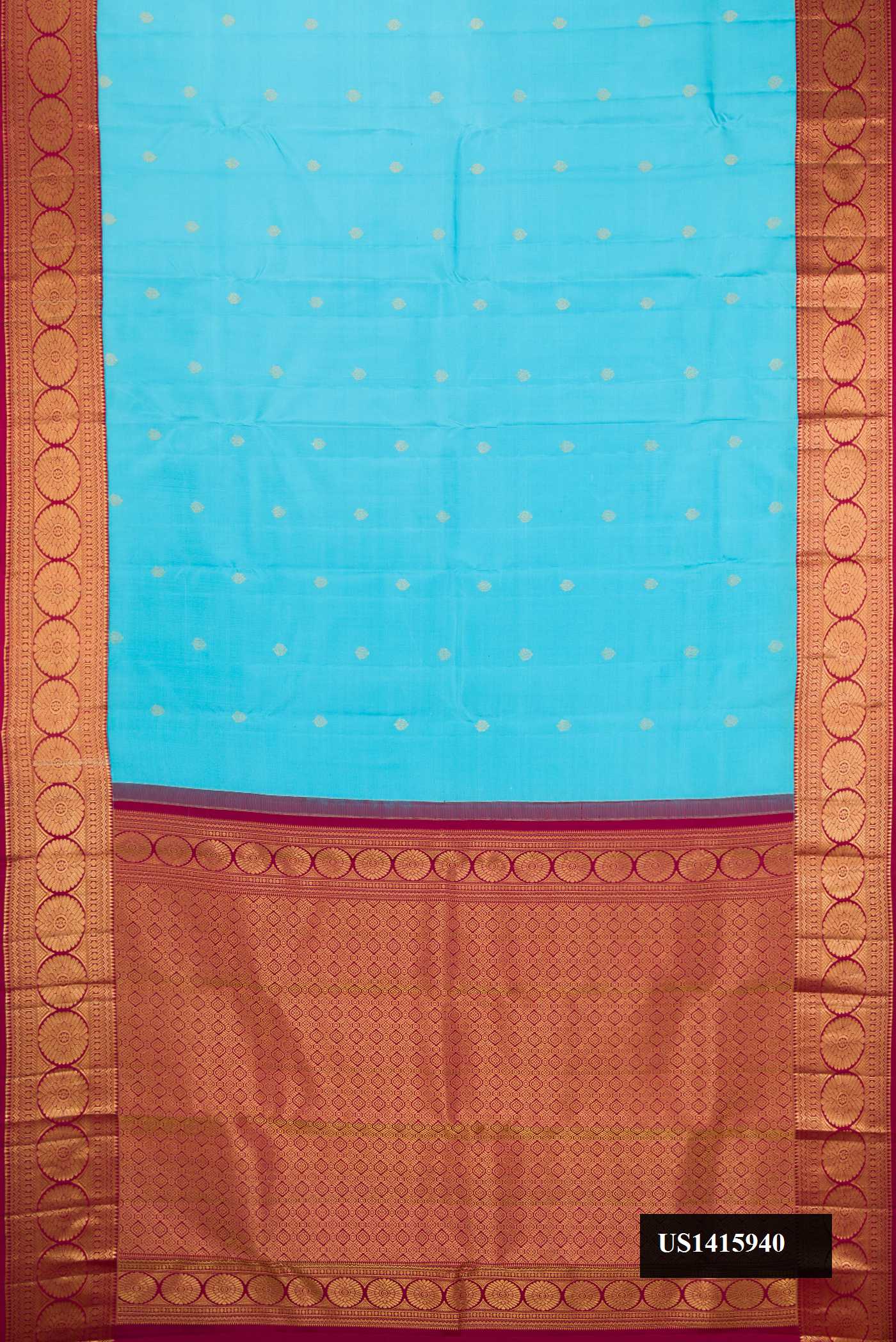Light Blue Dual Tone Kanchipuram Silk Saree with Zari Butta on the body and Zari Border.  displayed on a mannequin