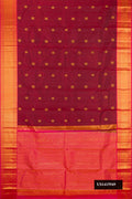 Maroon Dual Tone Kanchipuram Silk Saree with Zari Butta on the body and Zari Border.  displayed on a mannequin