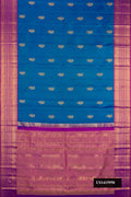 Peacock Blue Dual Tone Kanchipuram Silk Saree with Zari Butta on the body and Zari Border.  displayed on a mannequin