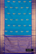 Blue Dual Tone Kanchipuram Silk Saree with Zari Butta on the body and Zari Border.  displayed on a mannequin
