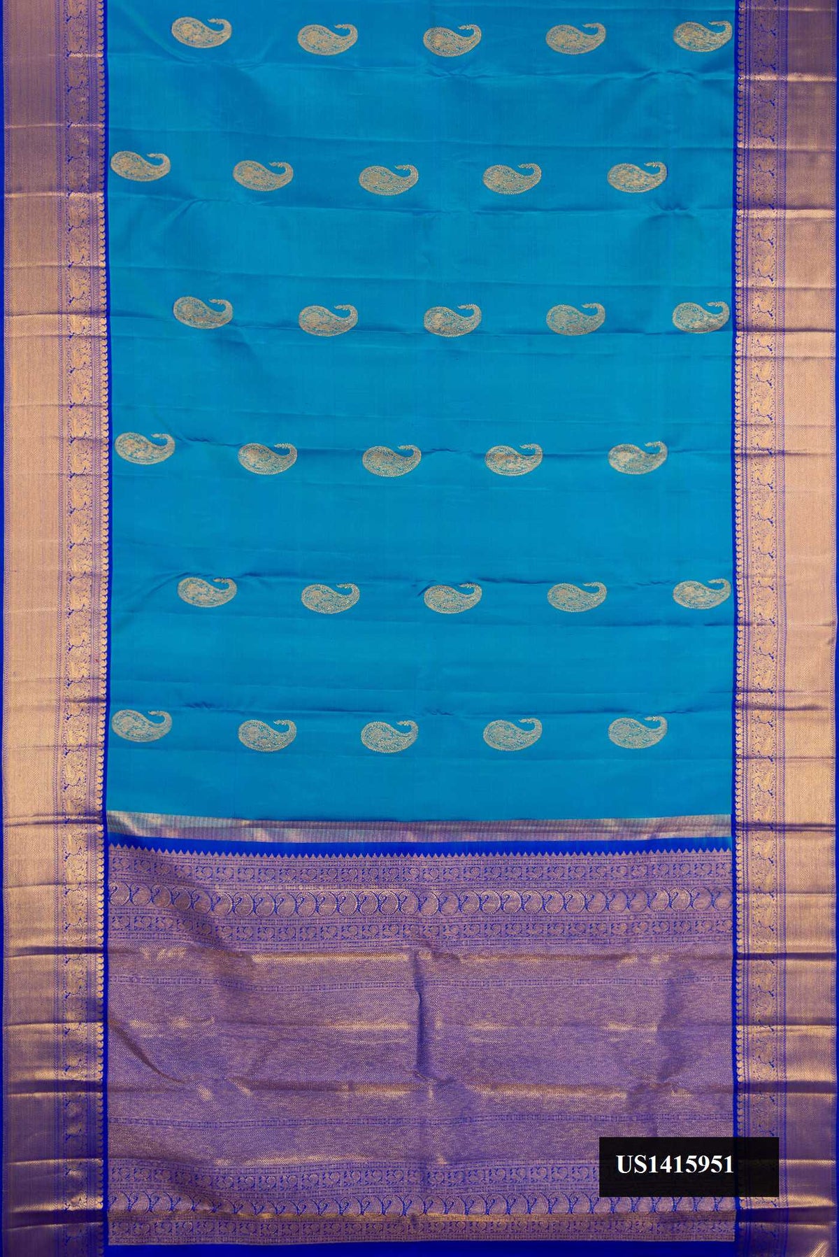 Blue Dual Tone Kanchipuram Silk Saree with Zari Butta on the body and Zari Border.  displayed on a mannequin