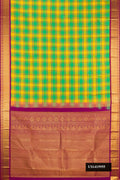 Multi Dual Tone Kanchipuram Silk Saree with Checked design on the body and Zari Border.  displayed on a mannequin