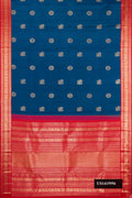 Peacock Blue Dual Tone Kanchipuram Silk Saree with Zari Butta on the body and Zari Border.  displayed on a mannequin