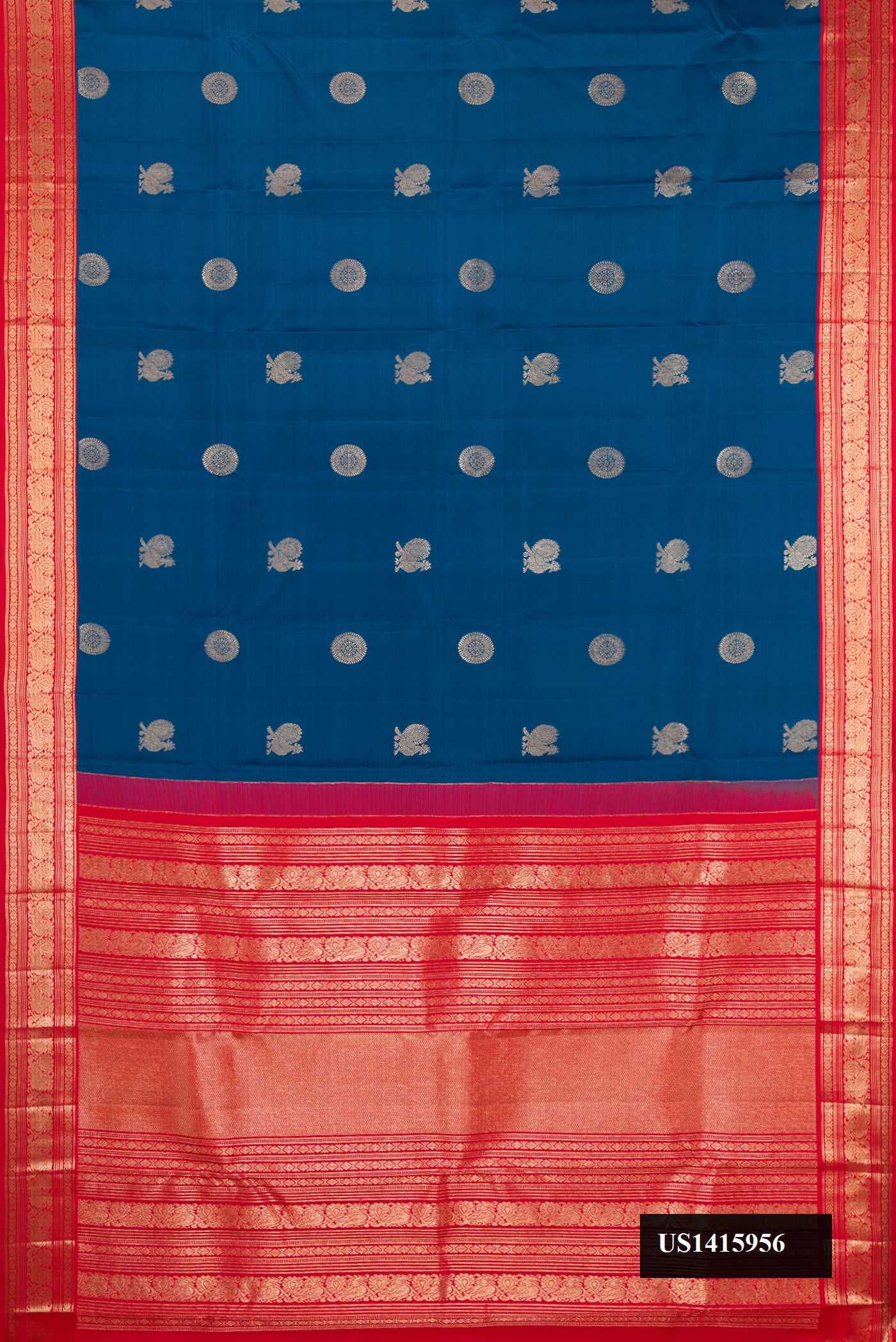 Peacock Blue Dual Tone Kanchipuram Silk Saree with Zari Butta on the body and Zari Border.  displayed on a mannequin