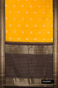 Yellow Dual Tone Kanchipuram Silk Saree with Zari Butta on the body and Zari Border.  displayed on a mannequin