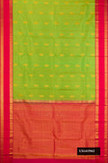 Parrot Green Dual Tone Kanchipuram Silk Saree with Zari Butta on the body and Zari Border.  displayed on a mannequin
