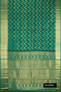 Bottle Green Dual Tone Kanchipuram Silk Saree with Zari Brocade on the body and Zari Border.  displayed on a mannequin