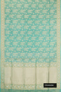 Light Blue Dual Tone Banarasi Silk Saree with Zari Brocade on the body and Zari Border.  displayed on a mannequin