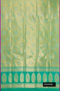 Green Dual Tone Banarasi Silk Saree with Zari Brocade on the body and Plain Border.  displayed on a mannequin