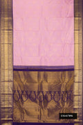 Lavender Dual Tone Kanchipuram Silk Saree with Zari Brocade on the body and Zari Border.  displayed on a mannequin