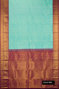 Sky Blue Dual Tone Kanchipuram Silk Saree with Zari Brocade on the body and Fancy Border.  displayed on a mannequin