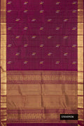 Burgundy Dual Tone Kanchipuram Silk Saree with Checked design on the body and Zari Border.  displayed on a mannequin
