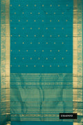 Peacock Blue Dual Tone Kanchipuram Silk Saree with Zari Butta on the body and Zari Border.  displayed on a mannequin