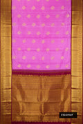 Lavender Dual Tone Kanchipuram Silk Saree with Zari Butta on the body and Zari Border.  displayed on a mannequin