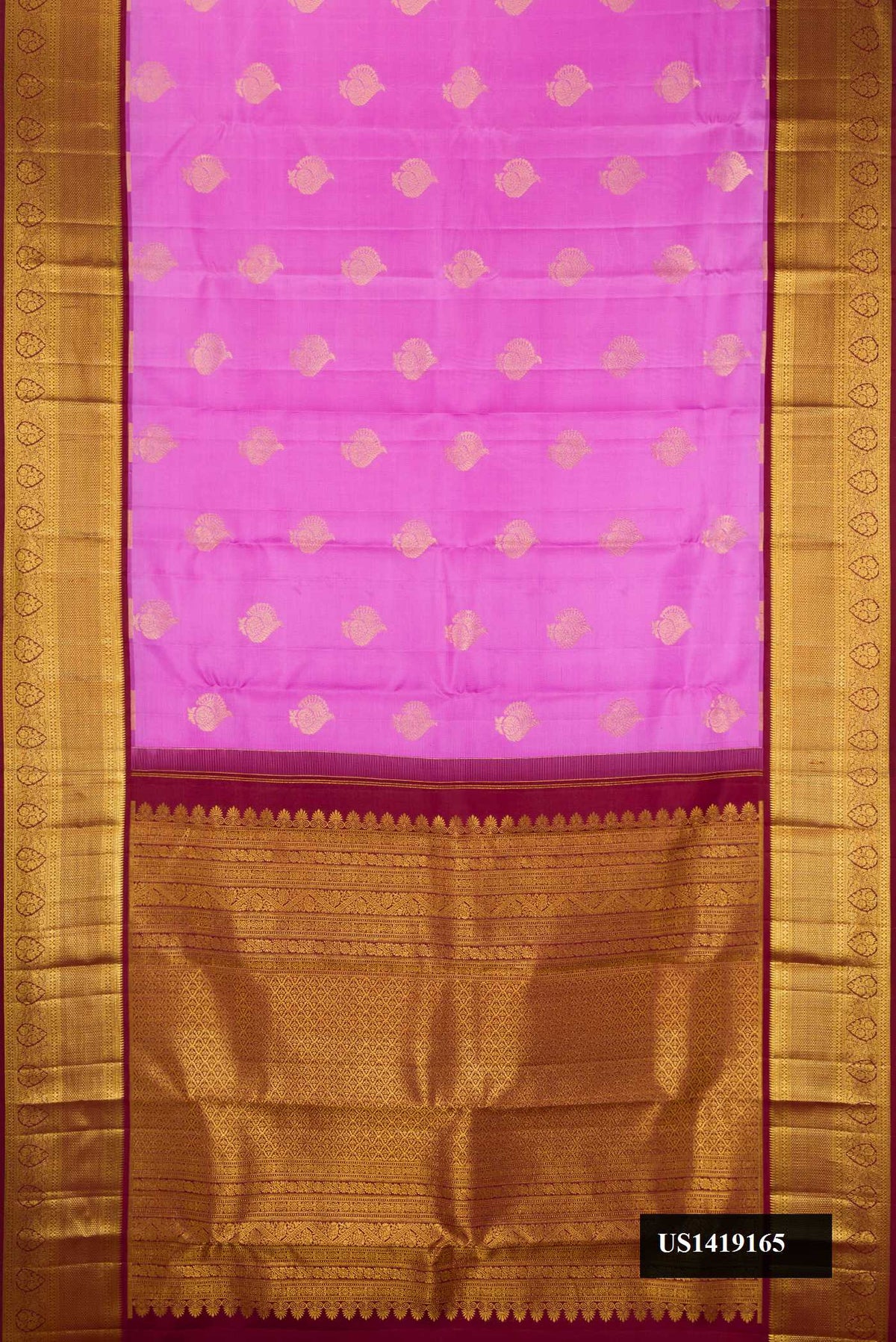 Lavender Dual Tone Kanchipuram Silk Saree with Zari Butta on the body and Zari Border.  displayed on a mannequin