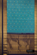 Light Blue Dual Tone Kanchipuram Silk Saree with Zari Butta on the body and Zari Border.  displayed on a mannequin