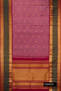Rose Gold Dual Tone Kanchipuram Silk Saree with Zari Butta on the body and Fancy Border.  displayed on a mannequin