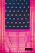 Navy Blue Dual Tone Kanchipuram Silk Saree with Zari Butta on the body and Fancy Border.  displayed on a mannequin