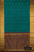 Green Dual Tone Kanchipuram Silk Saree with Zari Butta on the body and Fancy Border.  displayed on a mannequin