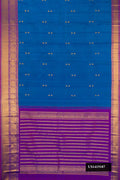 Peacock Blue Dual Tone Kanchipuram Silk Saree with Zari Butta on the body and Zari Border.  displayed on a mannequin