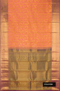 Peach Dual Tone Kanchipuram Silk Saree with Zari Brocade on the body and Zari Border.  displayed on a mannequin