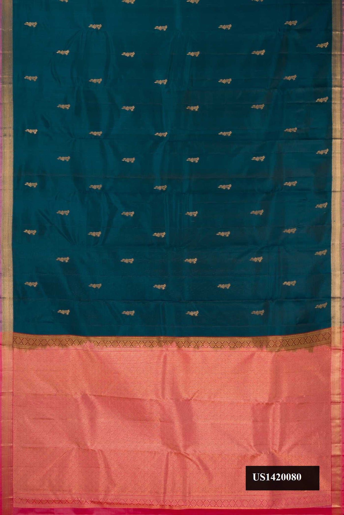 Green Dual Tone Kanchipuram Silk Saree with Zari Butta on the body and Zari Border.  displayed on a mannequin