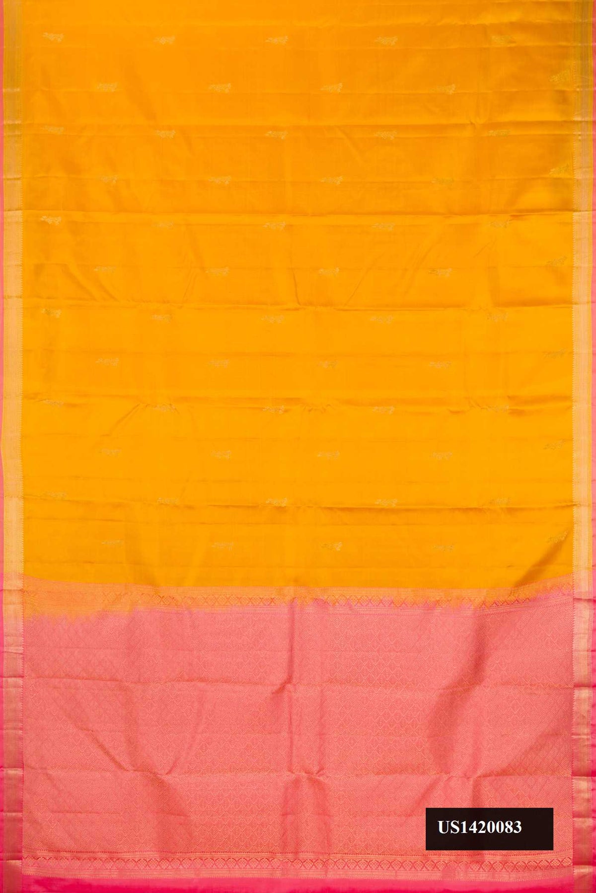 Mustard Dual Tone Kanchipuram Silk Saree with Zari Butta on the body and Zari Border.  displayed on a mannequin