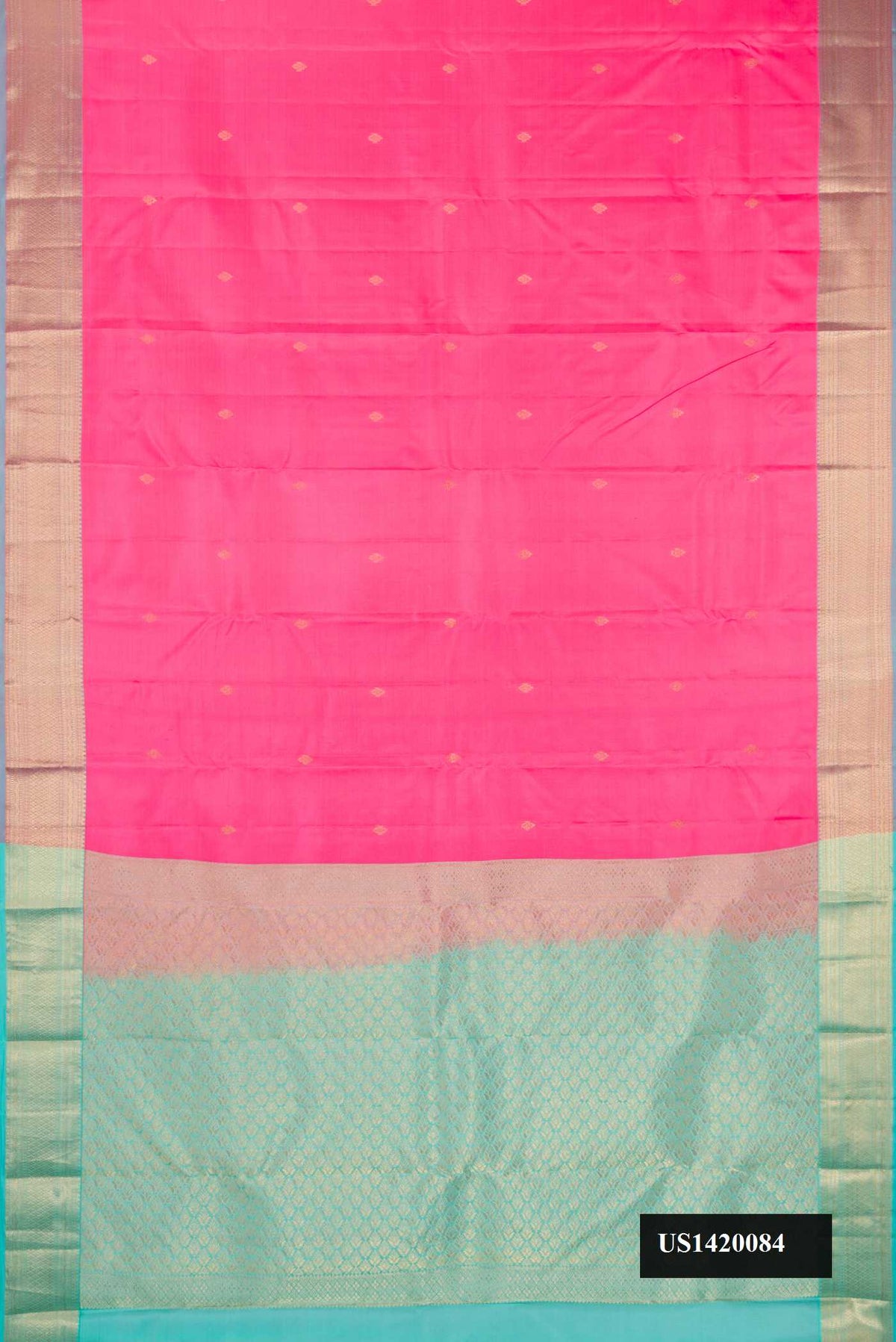 Pink Dual Tone Kanchipuram Silk Saree with Zari Butta on the body and Zari Border.  displayed on a mannequin