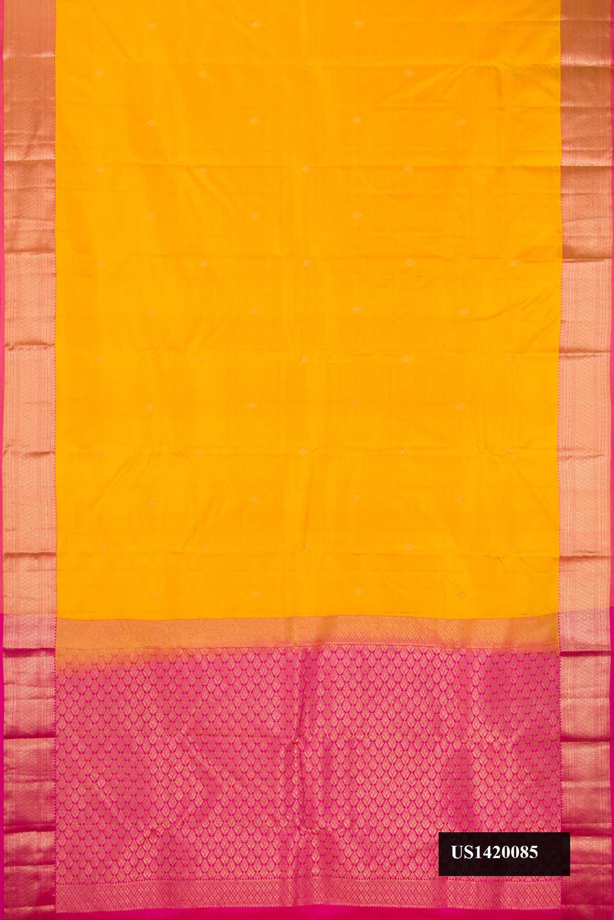 Mustard Dual Tone Kanchipuram Silk Saree with Zari Butta on the body and Zari Border.  displayed on a mannequin