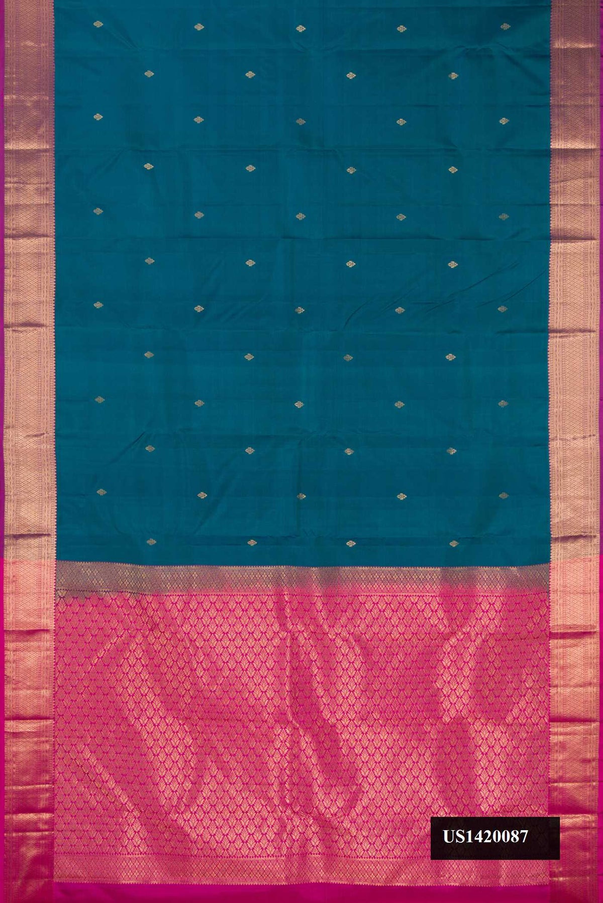 Peacock Blue Dual Tone Kanchipuram Silk Saree with Zari Butta on the body and Zari Border.  displayed on a mannequin