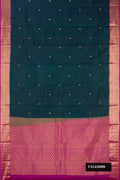 Peacock Blue Dual Tone Kanchipuram Silk Saree with Zari Butta on the body and Zari Border.  displayed on a mannequin