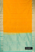 Mustard Dual Tone Kanchipuram Silk Saree with Zari Butta on the body and Zari Border.  displayed on a mannequin