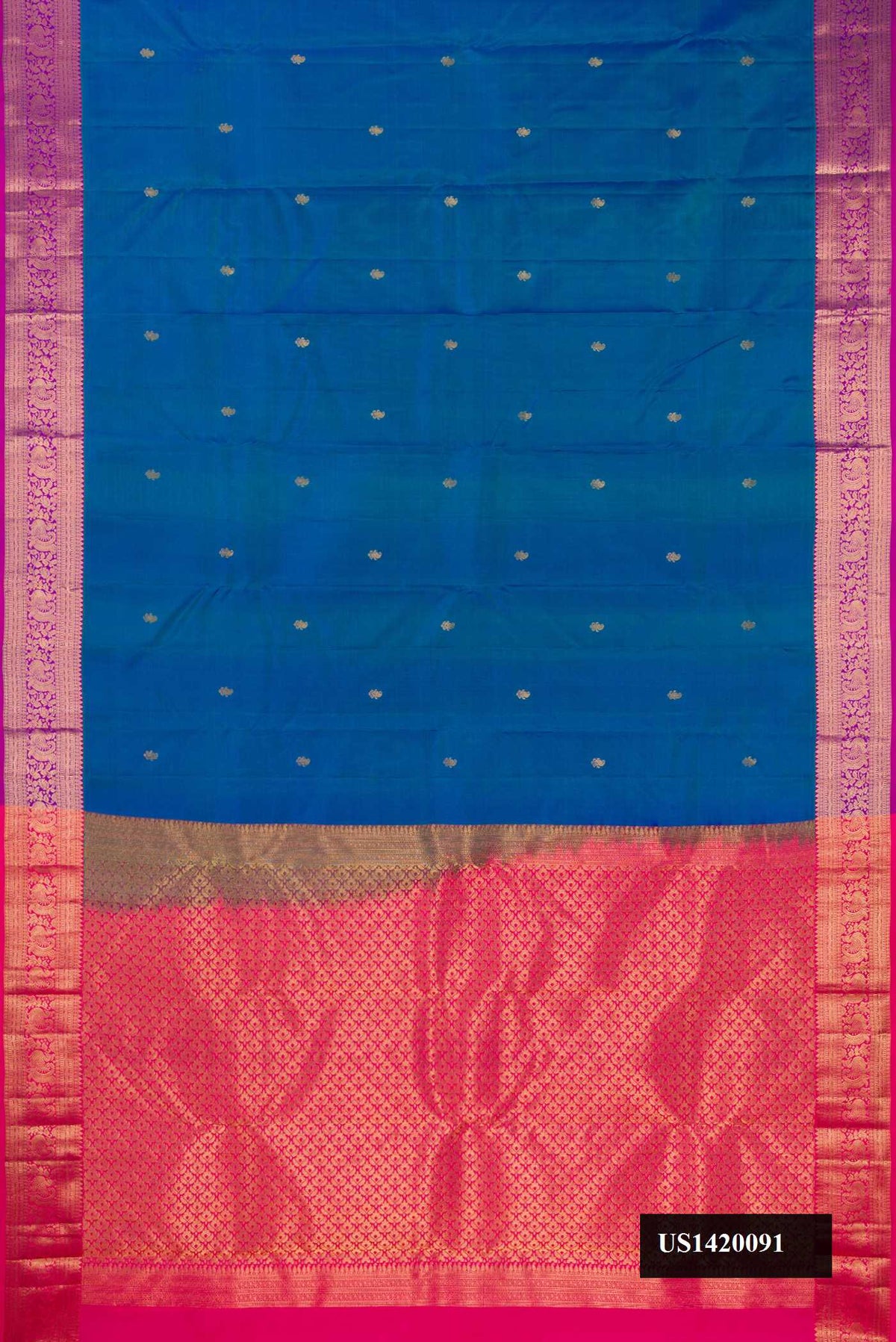 Peacock Blue Dual Tone Kanchipuram Silk Saree with Zari Butta on the body and Zari Border.  displayed on a mannequin