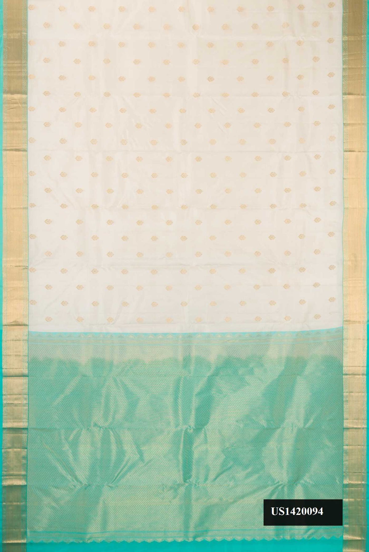 Off White Dual Tone Kanchipuram Silk Saree with Zari Butta on the body and Zari Border.  displayed on a mannequin