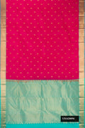 Dark Pink Dual Tone Kanchipuram Silk Saree with Zari Butta on the body and Zari Border.  displayed on a mannequin