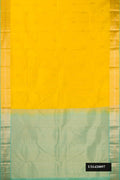 Yellow Dual Tone Kanchipuram Silk Saree with Zari Butta on the body and Zari Border.  displayed on a mannequin