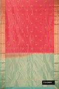 Rose Gold Dual Tone Kanchipuram Silk Saree with Zari Butta on the body and Zari Border.  displayed on a mannequin