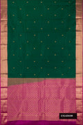 Bottle Green Dual Tone Kanchipuram Silk Saree with Zari Butta on the body and Zari Border.  displayed on a mannequin