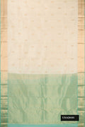 Beige Dual Tone Kanchipuram Silk Saree with Zari Butta on the body and Zari Border.  displayed on a mannequin