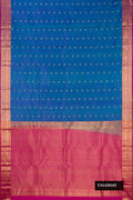 Peacock Blue Dual Tone Kanchipuram Silk Saree with Zari Butta on the body and Zari Border.  displayed on a mannequin