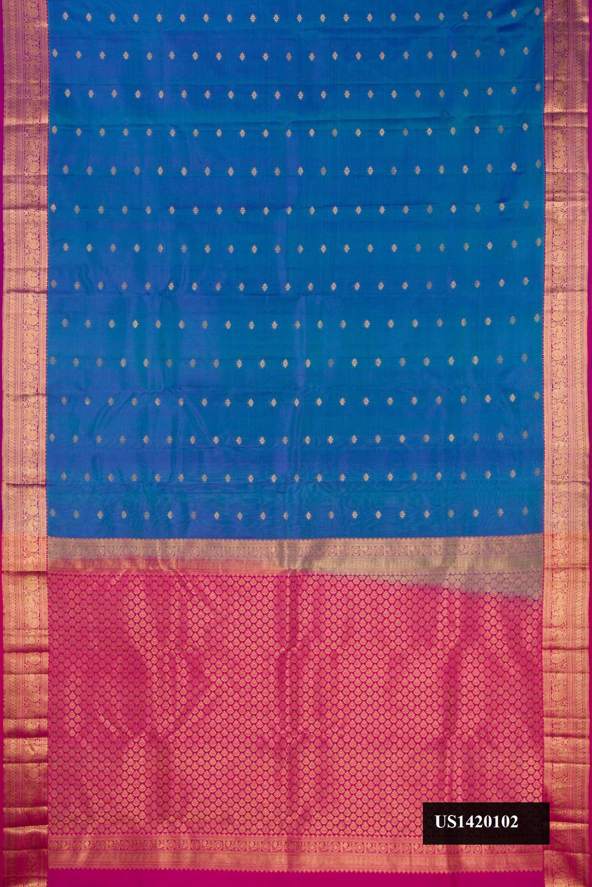 Peacock Blue Dual Tone Kanchipuram Silk Saree with Zari Butta on the body and Zari Border.  displayed on a mannequin