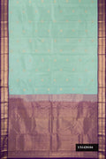 Pista Green Dual Tone Kanchipuram Silk Saree with Zari Butta on the body and Zari Border.  displayed on a mannequin