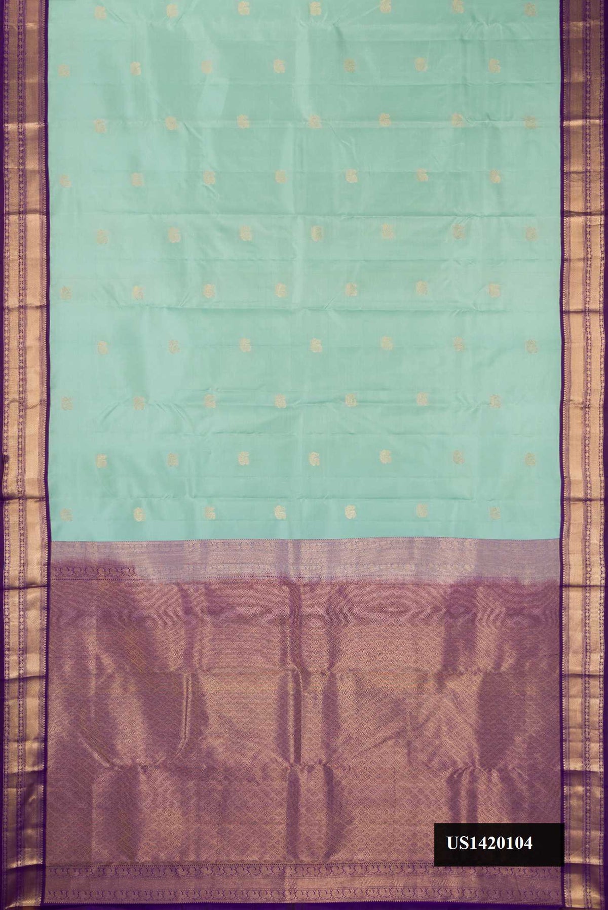 Pista Green Dual Tone Kanchipuram Silk Saree with Zari Butta on the body and Zari Border.  displayed on a mannequin