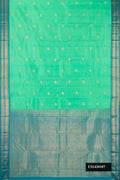 Sea Green Dual Tone Kanchipuram Silk Saree with Zari Butta on the body and Zari Border.  displayed on a mannequin