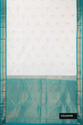 Off White Dual Tone Kanchipuram Silk Saree with Zari Butta on the body and Zari Border.  displayed on a mannequin