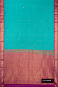 Sky Blue Dual Tone Kanchipuram Silk Saree with Zari Butta on the body and Zari Border.  displayed on a mannequin