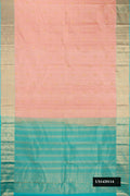 Peach Dual Tone Kanchipuram Silk Saree with Zari Butta on the body and Zari Border.  displayed on a mannequin